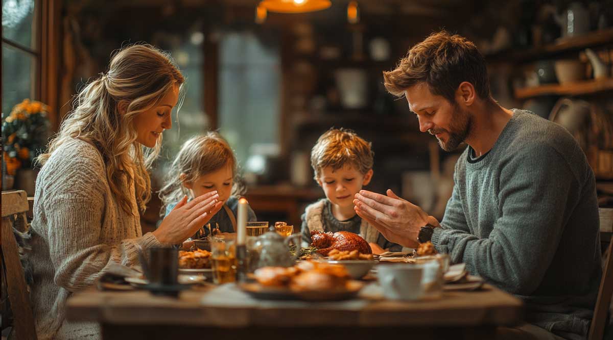 A family gathered around a dinner table holding hands in prayer symbolizing blessings received through obedience